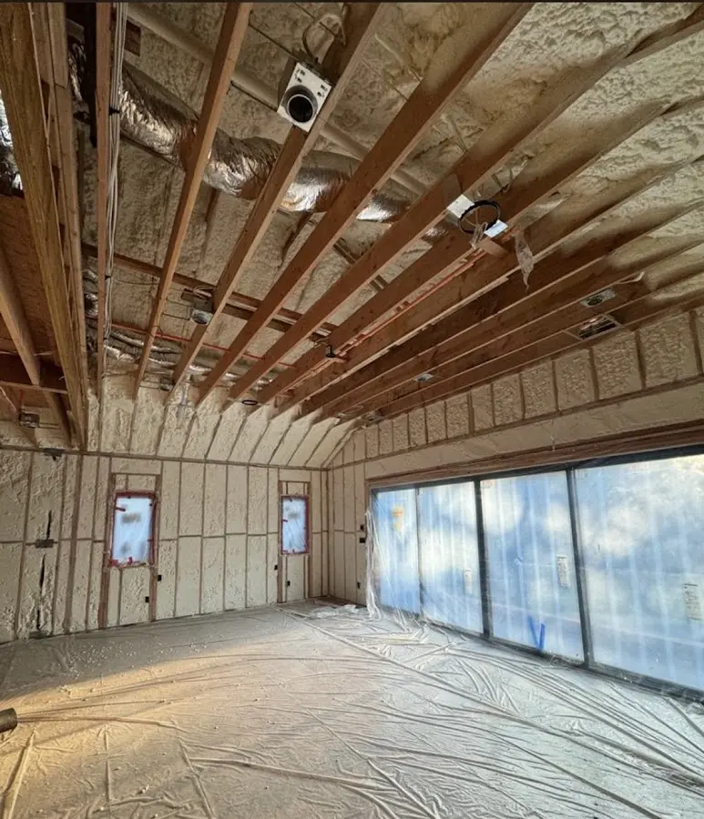 Interior walls and ceiling insulated with spray foam during new construction in The Pinery
